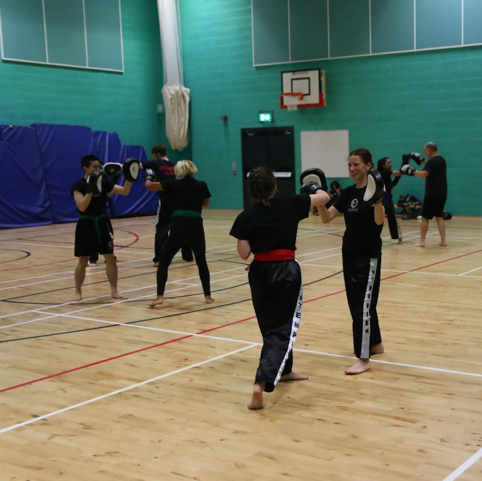 Adults training together in a TMA class